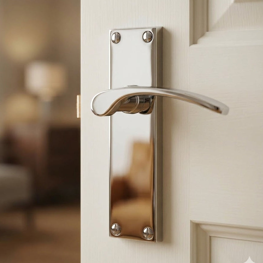 Curved polished chrome lever handles on long backplates illustrating a typical internal lever set