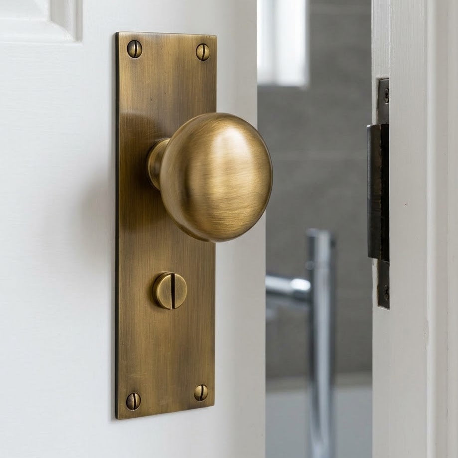 Heritage Balmoral Antique Brass Knob on Bathroom Plate