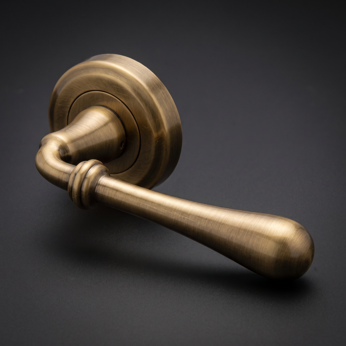 Roma Distressed Brass Decorative Lever on Round Rose