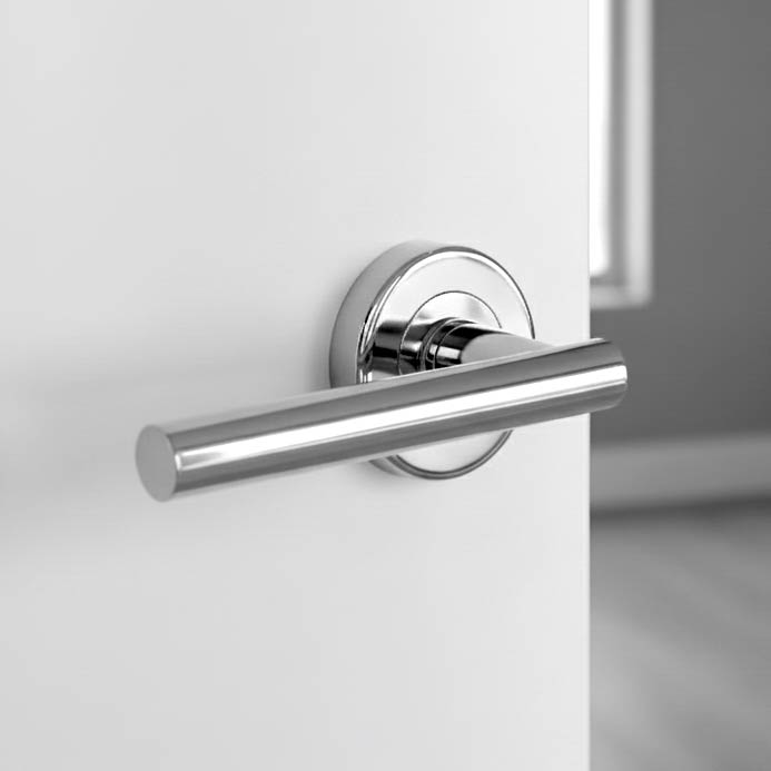 Polished chrome lever on rose handle fitted to an internal white door