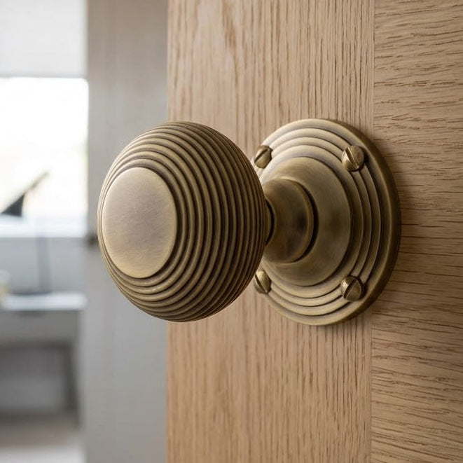 Heritage V971 Antique Brass Reeded Door Knobs 60mm