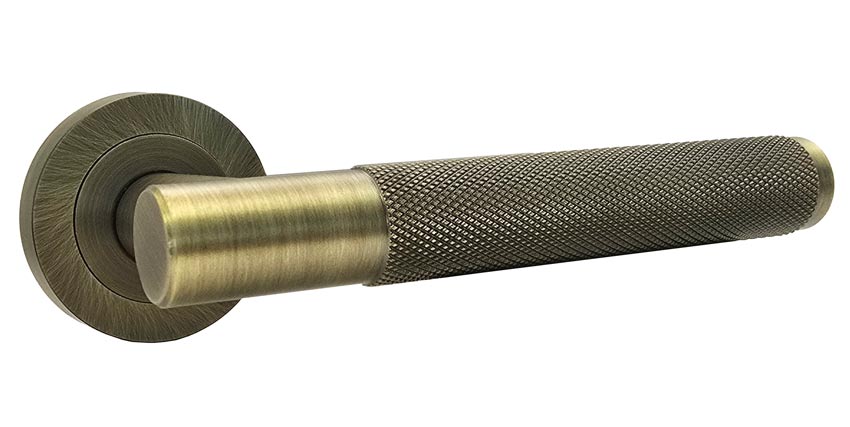 Bari Knurled Lever on Rose Antique Brass Door Handles