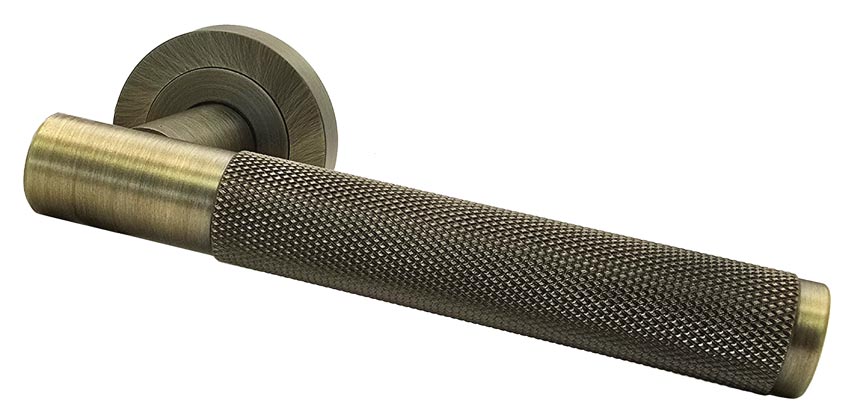 Bari Knurled Lever on Rose Antique Brass Door Handles
