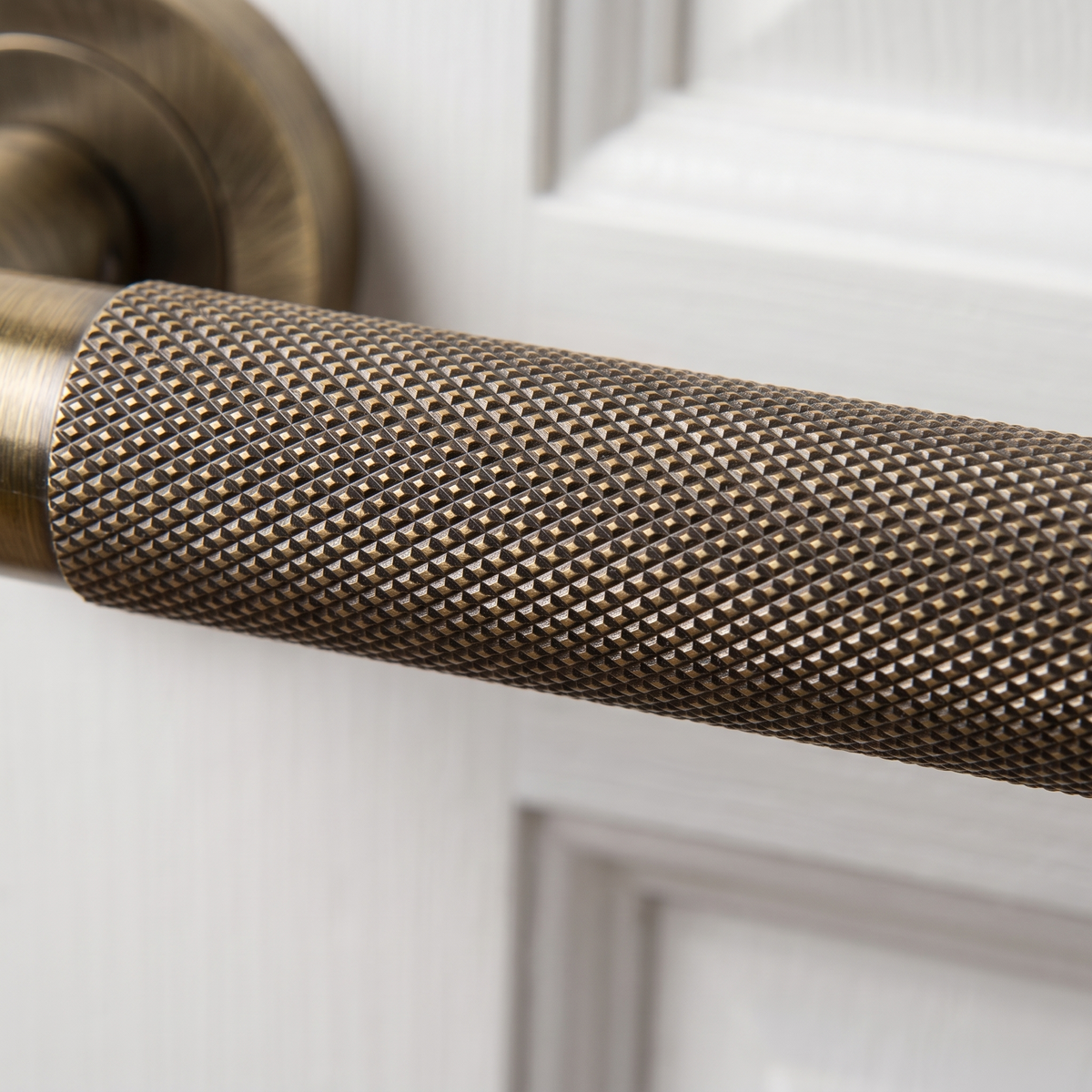 Bari Knurled Lever on Rose Antique Brass Door Handles