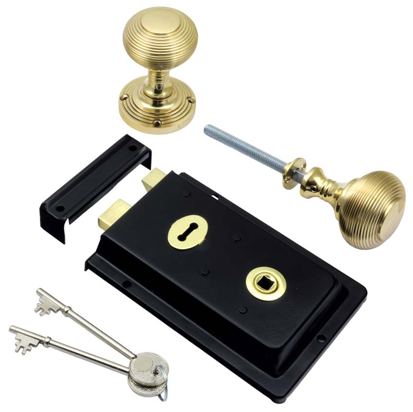 Black Rim Lock and Polished Brass Reeded Rim Knob Set