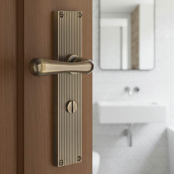 Charlbury Reeded Antique Brass Bathroom Door Handles RR3030