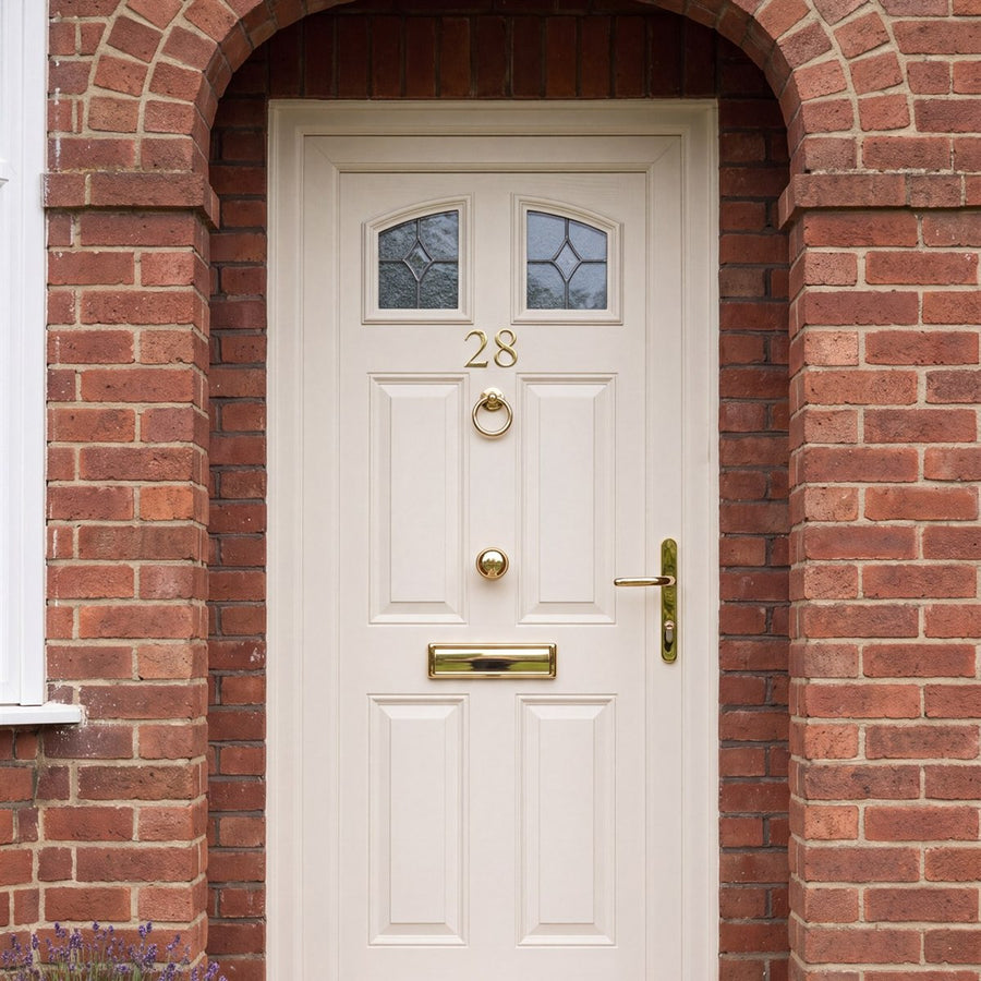 Cream uPVC front door with gold door furniture