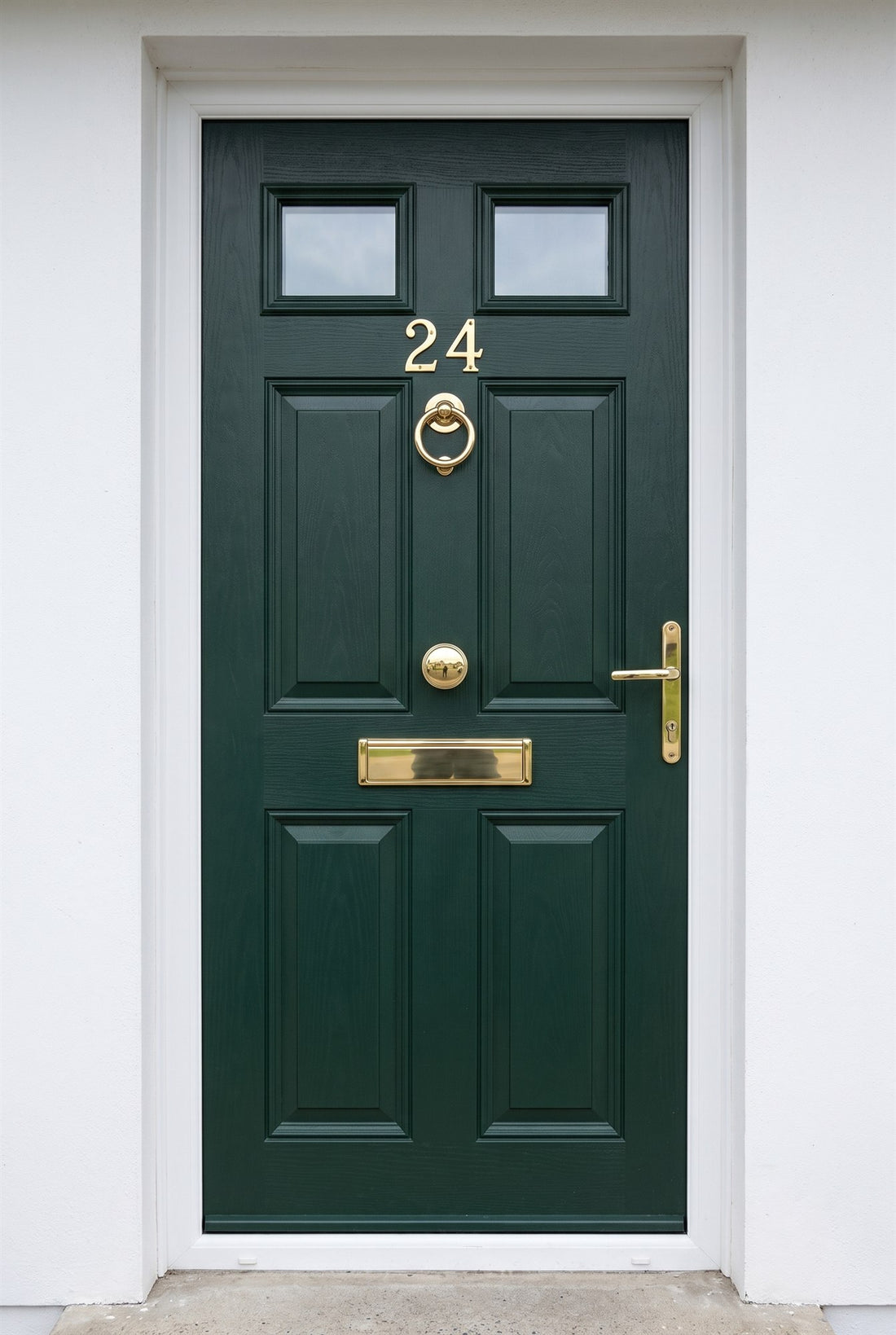 Heritage green composite front door with Hardex gold numerals, bull-ring knocker, centre knob, telescopic letter plate and multipoint lever handle