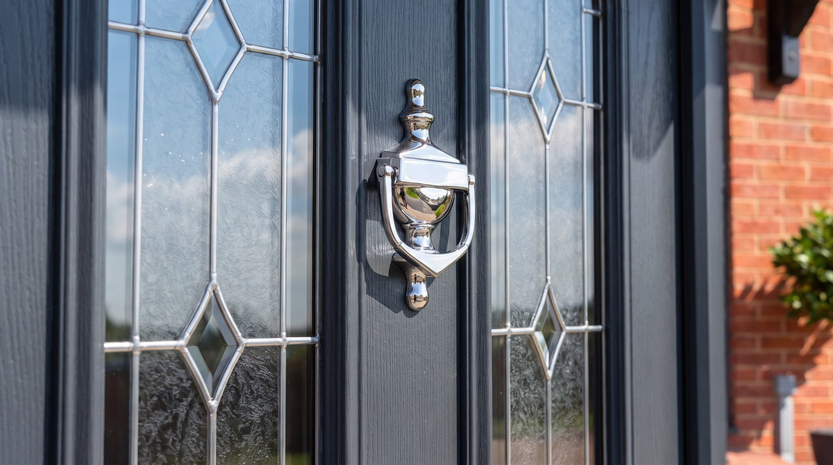 Hardex chrome Victorian urn knocker between two arched leaded glass panels on an anthracite grey woodgrain composite door