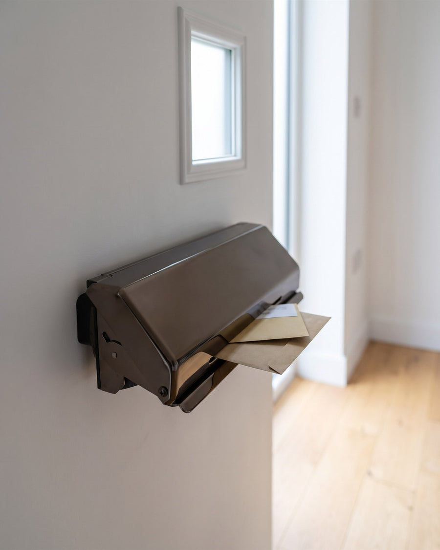 Hardex bronze Nu Mail internal shield hood holding envelopes on the inside of the front door