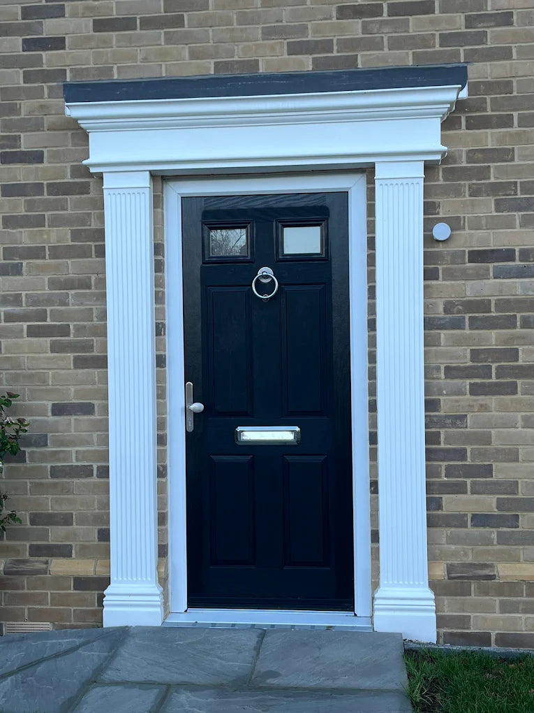 Traditional front door with decorative ironmongery